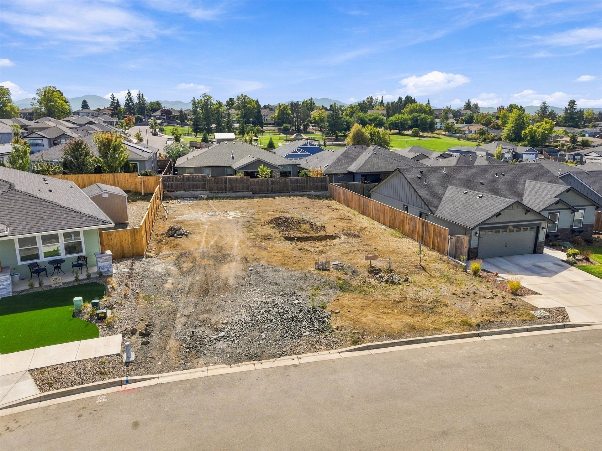 3075 Umpqua Drive, lot with new cedar fencing on three sides